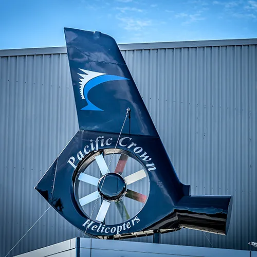 Close-up of helicopter fenestron showcasing Pacific Crown Helicopters logo