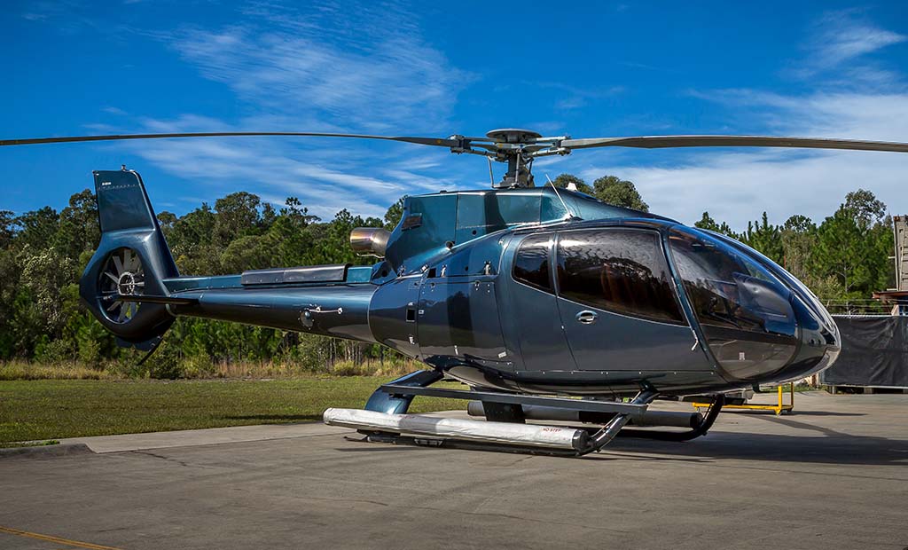 EC130 B4 parked outside on a concrete slab