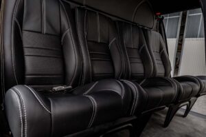h125 interior, Custom AS350 Interior, black perforated leather and carpet flooring