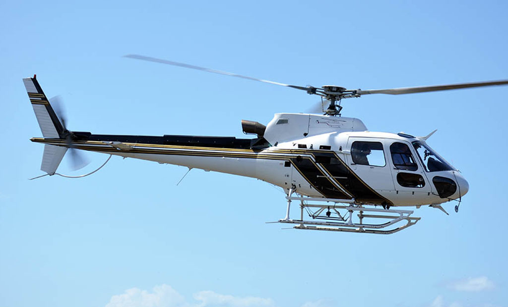 Airbus AS350 B3 Helicopter flying in the sky