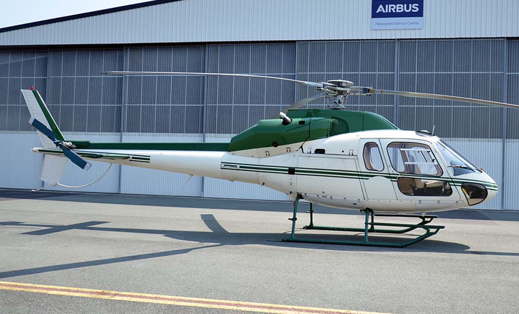 Airbus AS355 F1 In front of Pacific Crown helicopters hangar