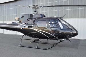 Airbus AS350 B3+ in front of hangar