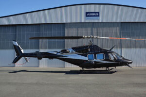 Bell 222 in front of Pacific Crown Helicopters hangar