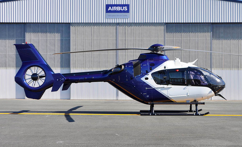 Polair EC135 P2+ helicopter in front of hangar