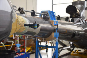 Close-ups of the EC130 B4 helicopter’s tail boom undergoing Level D repair