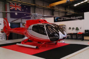 Helicopter on red carpet in hangar of Pacific Crown Helicopters