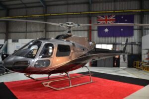 Airbus AS350 on a red carpet in the hangar of PCH