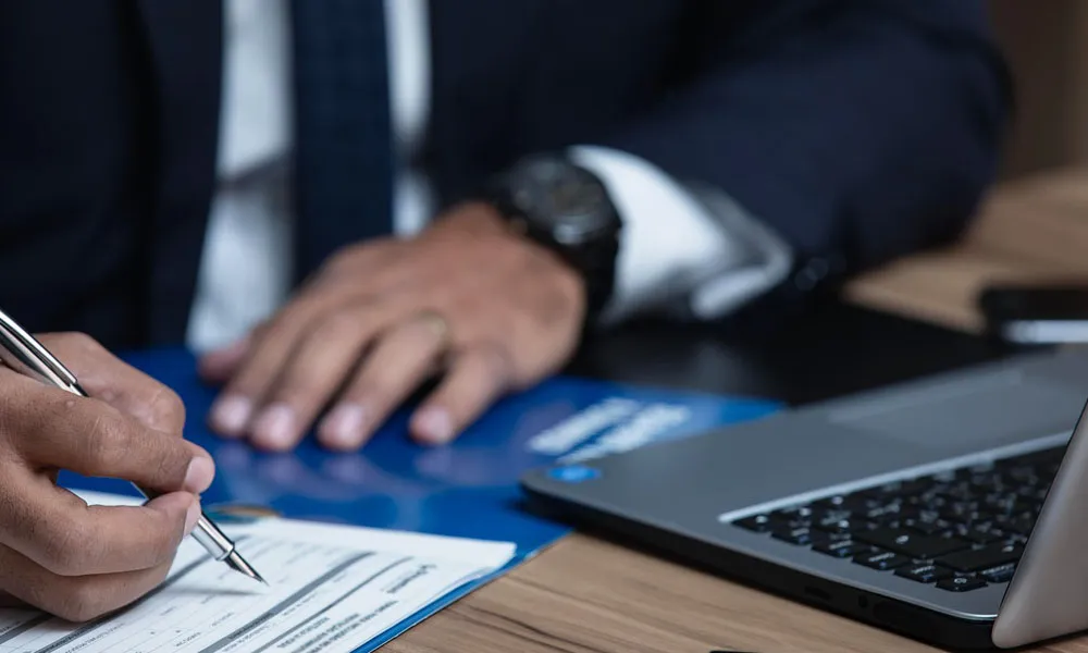 Signing aircraft delivery paperwork during post-sale process, helicopter sales